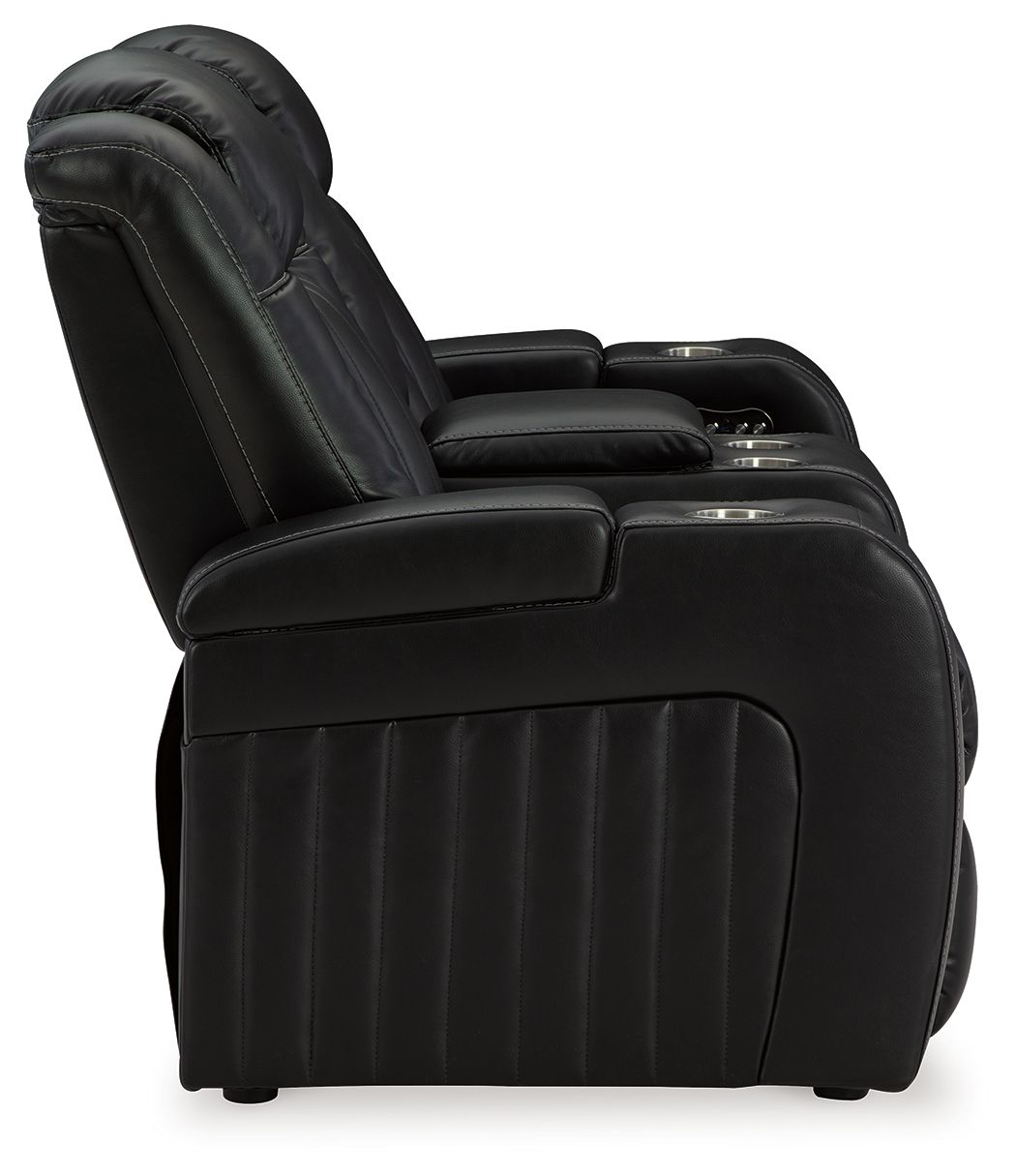 Caveman Den - Midnight - Power Reclining Loveseat with Console/ Adj Hdrst